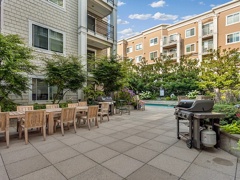 2nd floor pool terrace with grills, Ballard's only outdoor heated pool, and hot tub.