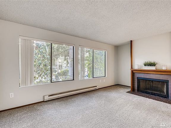 Very large living room space with wood burning fireplace.  Private end condo unit.  Lots of Windows!  New Carpet, new interior ceiling and wall paint thru out.