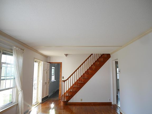 Living room over look the stairs going up to the second floor and first bed room entrance