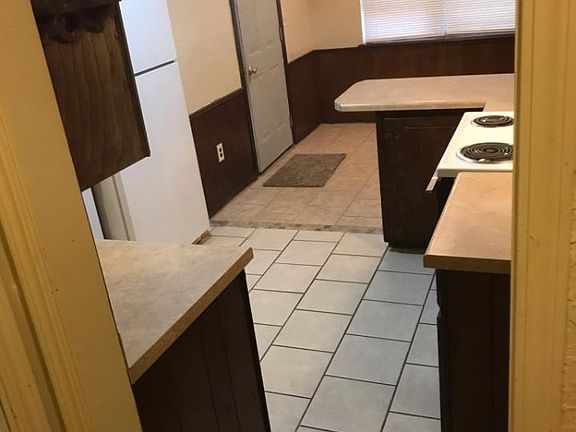 Kitchen with stove, refrigerator & dishwasher