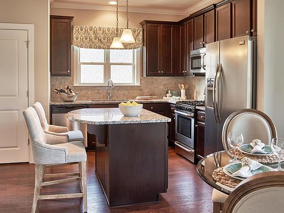 Island kitchen boasts Energy Star appliances and plentiful cabinetry