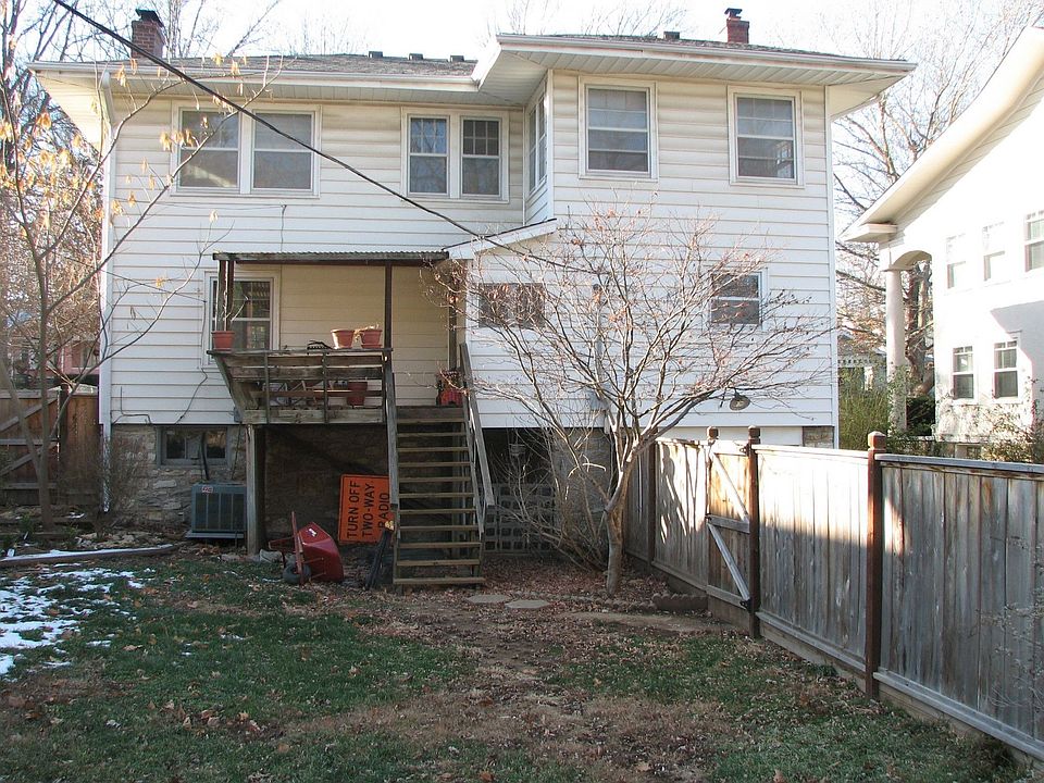 back of house with covered deck