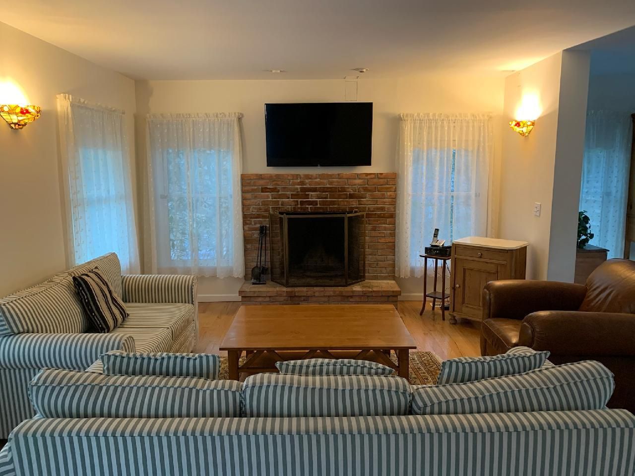  Custom brick fireplace and flatscreen tv in living room