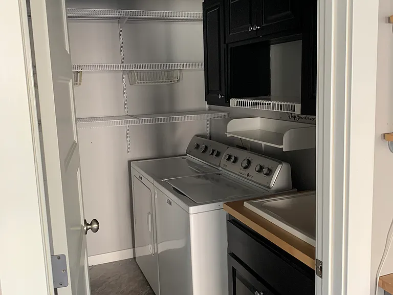 Laundry room with storage space