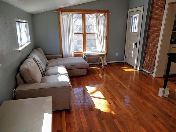 LARGE BEDROOM WITH BEAUTIFUL FLOORS AND PRIVATE DECK