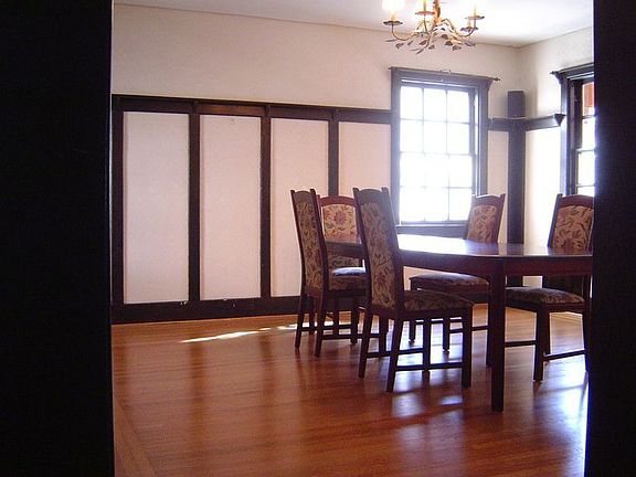 dining room with oak trim and plate rails