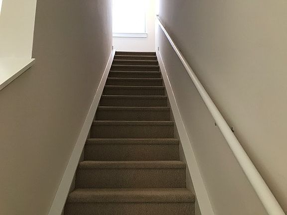 Stairwell leading to upstairs roof top terrace.