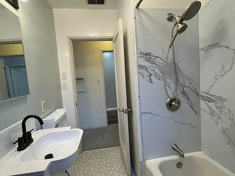 The sink, toiler and shower are all updated.