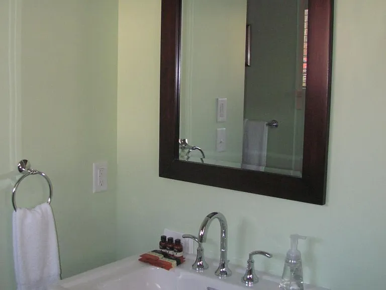 Main Level guest bathroom has pedestal sink