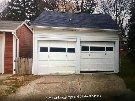 One car garage with driveway and on street parking