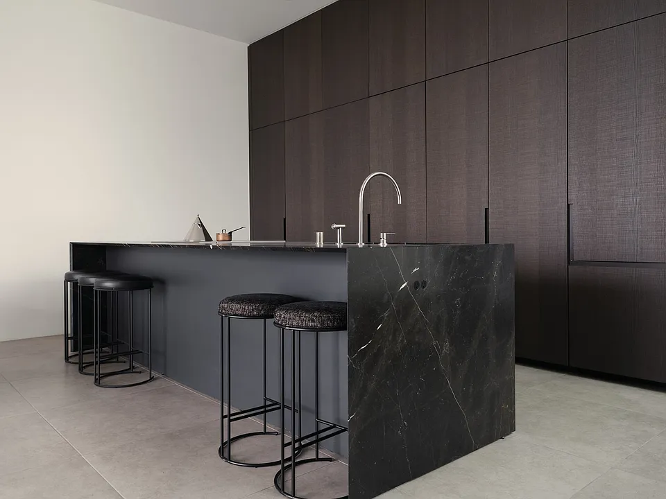 Chef's Kitchen with Striking Marble Island _ Crafted for culinary enthusiasts, this kitchen boasts premium marble countertops, seamless cabinetry, and integrated Miele appliances, ensuring both beauty and functionality.