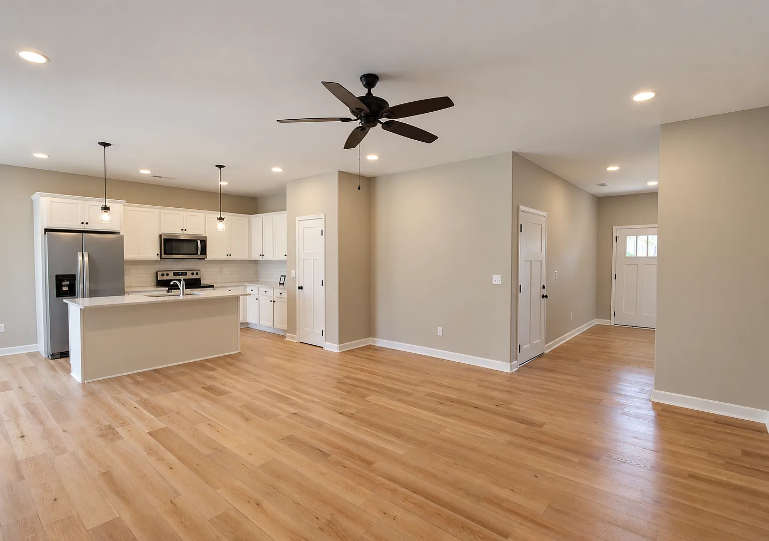 Open-Concept 3-Bedroom Home with a Fenced Backyard & Covered Patio — Photo 3