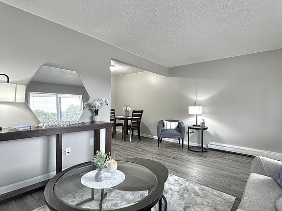 An inviting living room with a natural transition into the dining space.