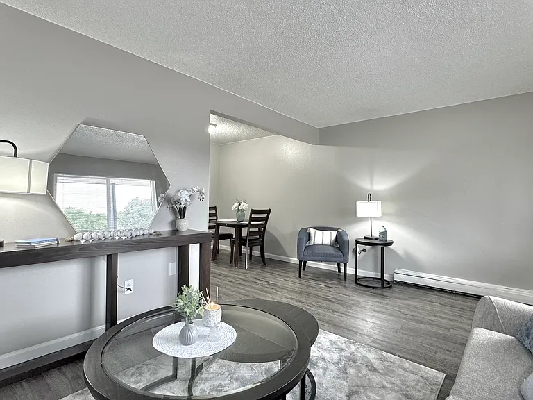 An inviting living room with a natural transition into the dining space.