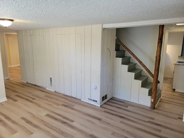 Front Room/Living Room (Stairs access upstairs unit but is locked off for security to upstairs unit and downstairs unit)