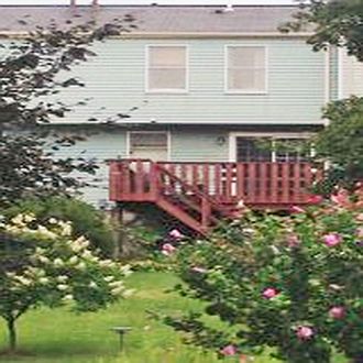 Deck Overlooks Backyard