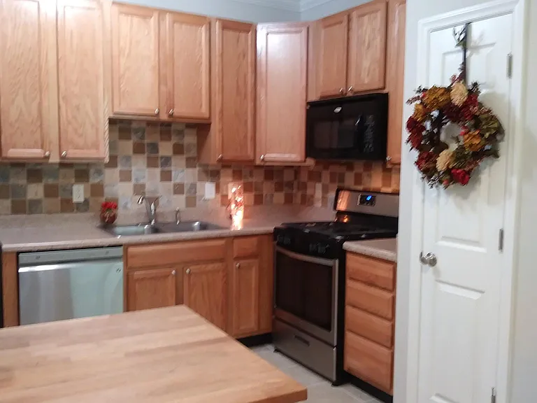 Refrigerator, Microwave, Oven, Garbage Disposal, Dishwasher, DBL Sink.