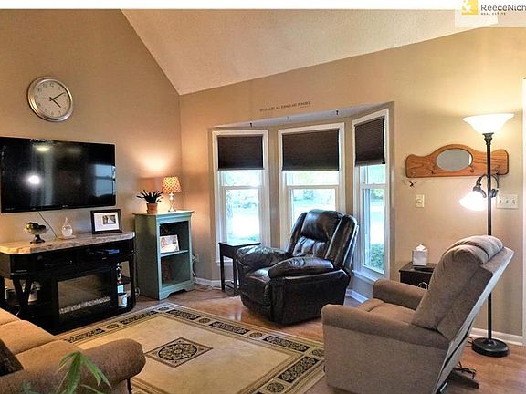 Front, Great Room with vaulted ceilings and bow-bay window.