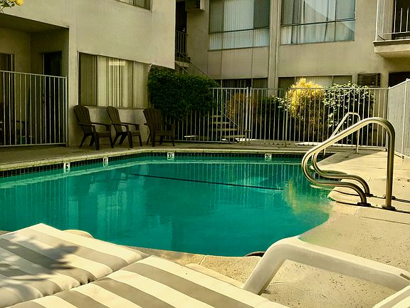 Lovely fenced courtyard & pool in center of building.