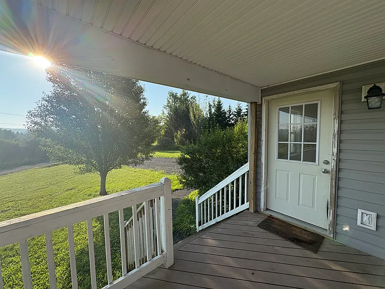 Seperate entrance from porch (2nd separate entrance from garage, no entrances shared with other apartment)