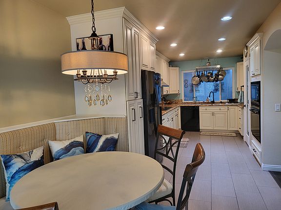 View of breakfast nook and kitchen area.