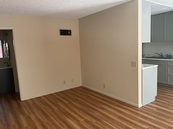 View of apartment from entryway.
Except for the bed and bath, there is faux hardwood flooring throughout.