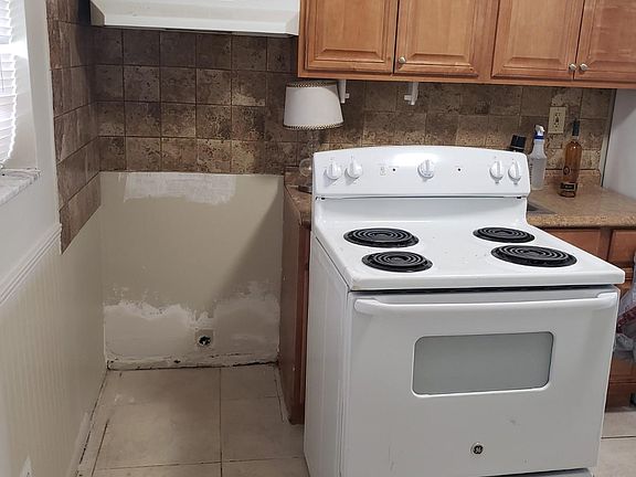 Work done behind the stove and new stove