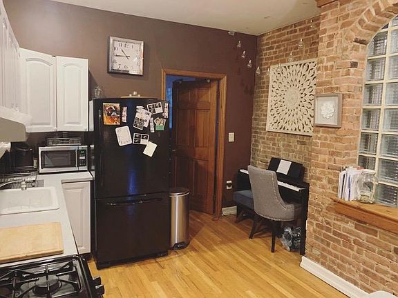 Kitchen and door to front bedroom