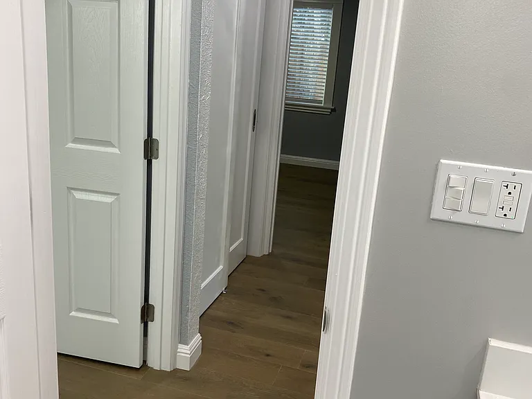 Bathroom facing hallway and bedrooms