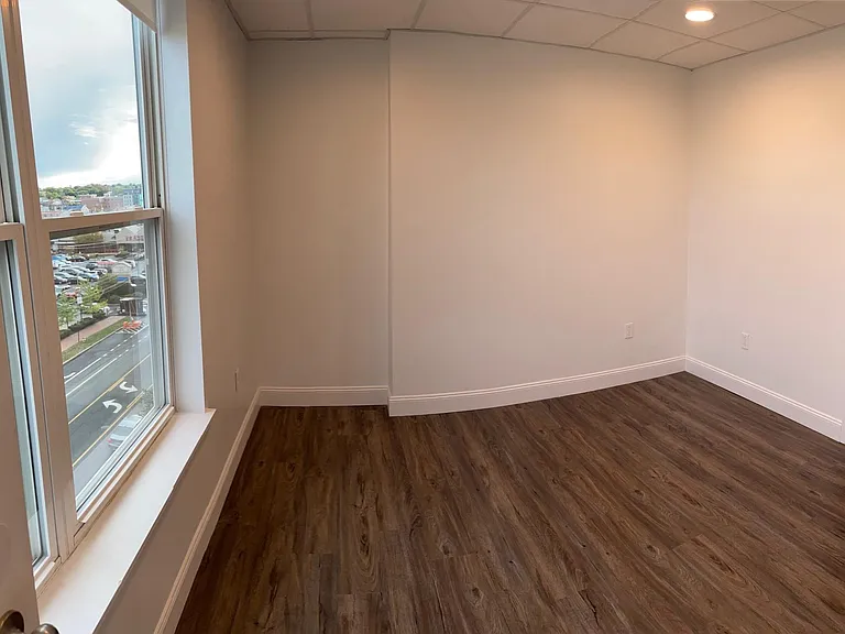 The bedroom of apartment 425 - The Linden's special top floor, corner one-bedroom with amazing city and Back Cove views!