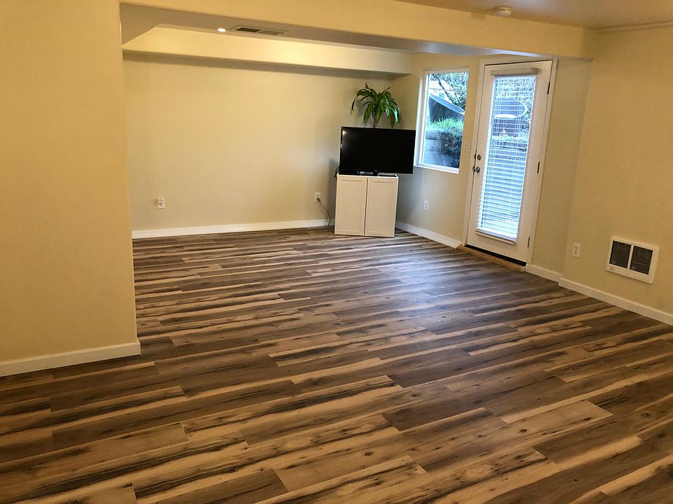 Living room area with New Laminate Flooring!