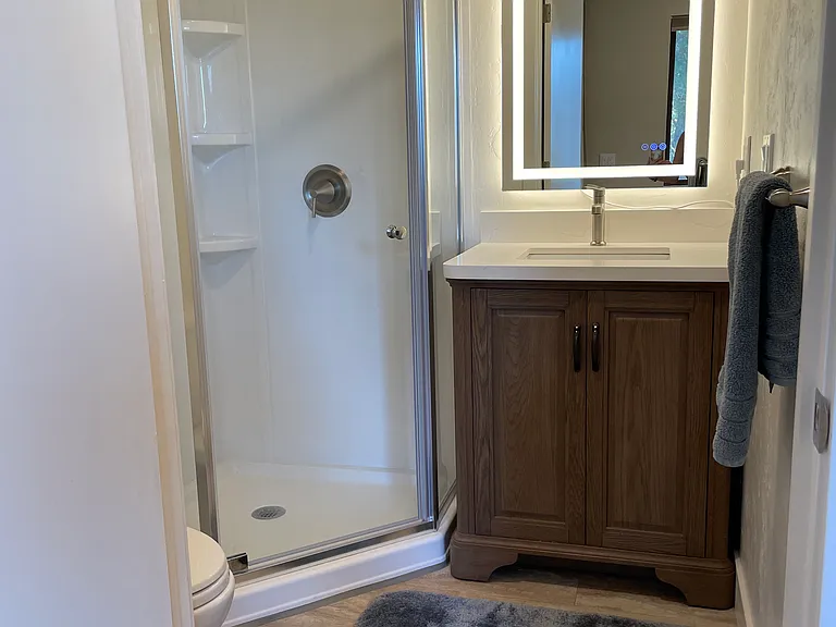 Terrific bathroom with new quiet fan.
Vanity has led mirror.