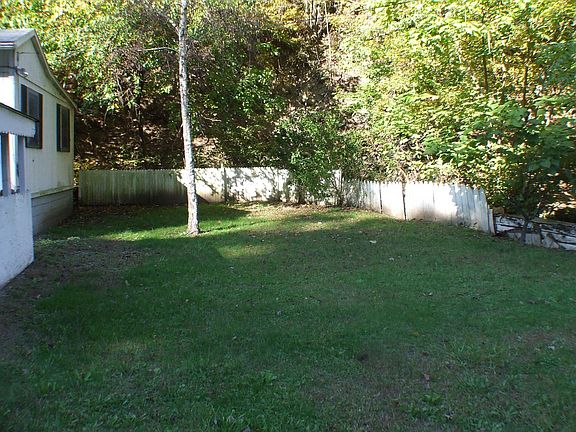 This home is situated on a large lot and includes property across the street.