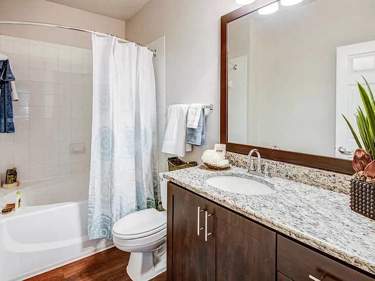 Bathroom with deep soaking tub and granite countertops