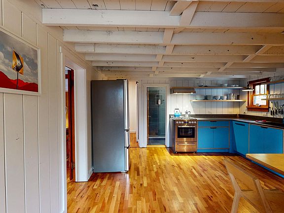 Fully stocked custom kitchen with modern appliances.