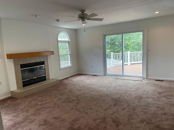 Family room with fireplace. Open to a large two level deck.