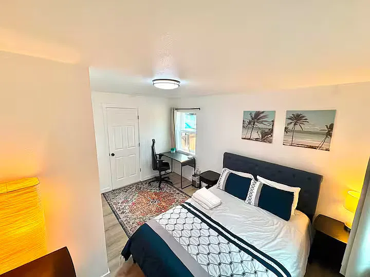 Private Room: Relax in a newly furnished queen bedroom, air conditioning, workspace, and spacious wardrobe.
