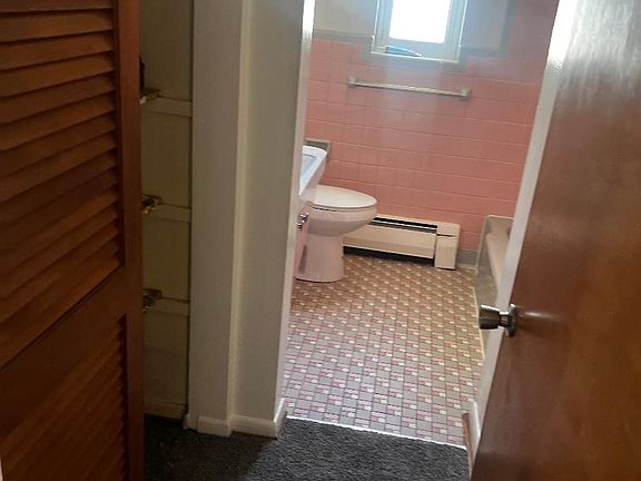 Bathroom showing with closet