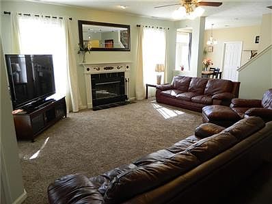 19x20 Family Room has lots of room to relax by the wood-burning fireplace. Opens to breakfast room and back stairs (there are 2 staircases), and back patio.