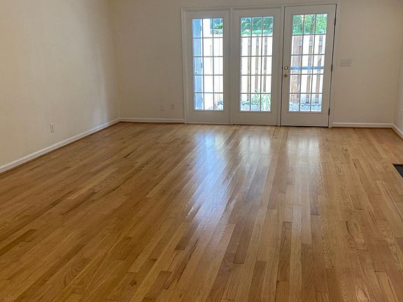 Living/dining room with French doors leading to patio.