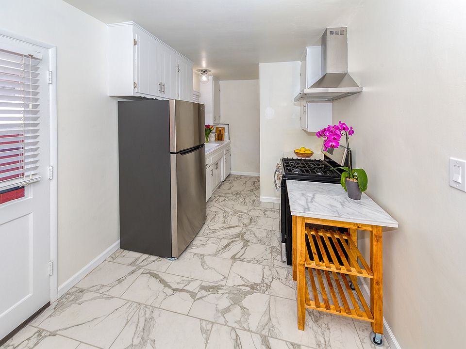 Kitchen: new white carrera marble floors, new stainless refrigerator, hood, gas stove, new faucet., lights, etc.