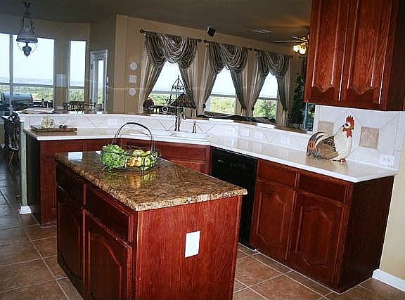 Kitchen overlooking breakfast room and great room and the view!