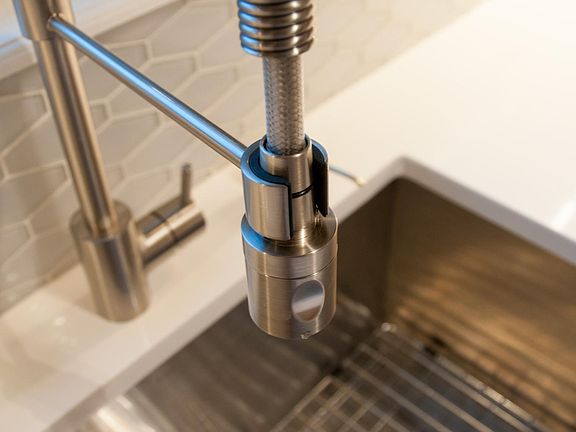 Designer pull-down faucet with extra deep stainless steel sink with garbage disposal