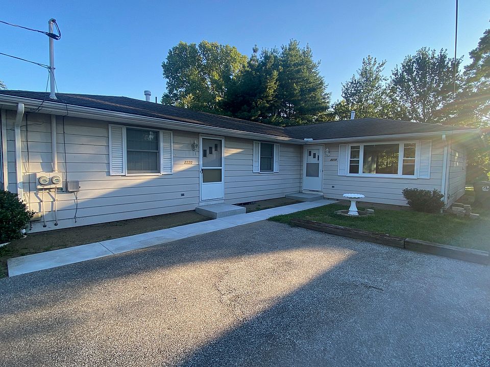 FRONT OF DUPLEX, NEW SIDEWALKS