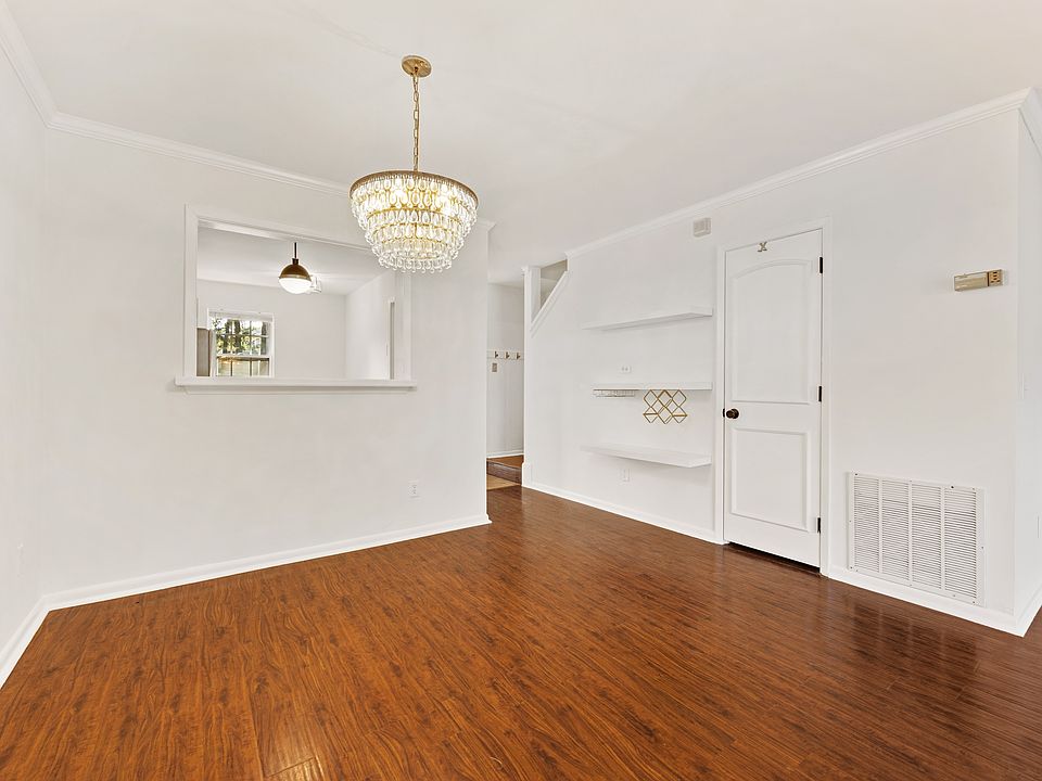 Dining area and wall shelves with mounted wine bottle holder and wine glass holder