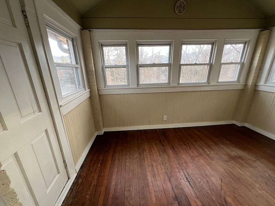 Entering sunroom/bedroom(no closet) with door to balcony on left