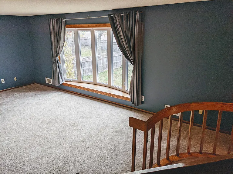 Living room 2 with large bay window to front yard