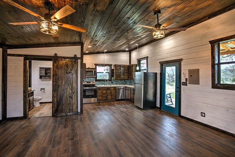 This is a view from where the bed would be into the kitchn and the bathroom It is an open floor plan.