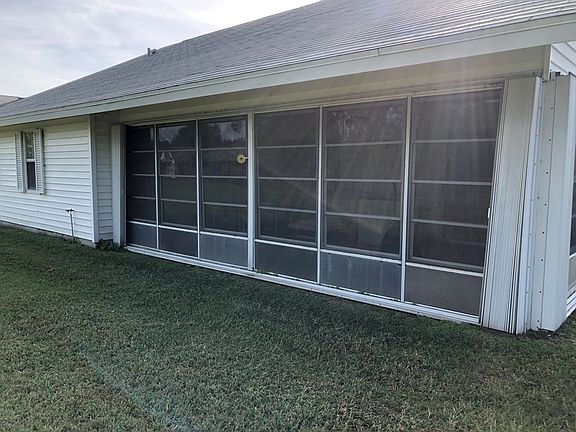 Large windowed back porch