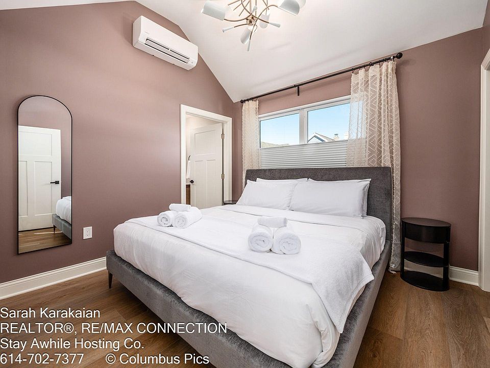 The larger bedroom has a king size bed. There is a closet with a 3-drawer dresser.